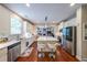 Bright kitchen featuring hardwood floors, stainless appliances, and a center island with seating at 4007 Fellowship Dr, Buford, GA 30519