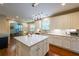Bright kitchen featuring hardwood floors, a center island, and stainless appliances at 4007 Fellowship Dr, Buford, GA 30519