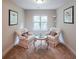 Cozy sitting room with matching upholstered chairs and round glass table at 4007 Fellowship Dr, Buford, GA 30519