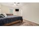Bedroom showcasing carpet flooring, neutral paint, ceiling fan and wall-mounted TV at 5288 Clingman Ct, Douglasville, GA 30135