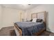 Cozy bedroom showcasing carpet flooring, neutral paint, and comfortable bedding at 5288 Clingman Ct, Douglasville, GA 30135