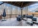 Covered wooden deck with outdoor seating, umbrella, and grill, great for outdoor relaxation at 5288 Clingman Ct, Douglasville, GA 30135