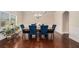 Stately dining room boasts hardwood floors, a chandelier, and a large window at 5288 Clingman Ct, Douglasville, GA 30135