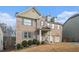 Charming brick home with blue shutters, a two-car garage, and a well-manicured lawn at 5288 Clingman Ct, Douglasville, GA 30135