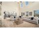 Open concept living room with a fireplace, a spacious seating area, and an archway to the kitchen at 5288 Clingman Ct, Douglasville, GA 30135