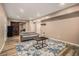 Living room featuring a gray couch, a barn door, and wood floors at 5288 Clingman Ct, Douglasville, GA 30135
