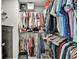 Walk-in closet with organized clothing racks, storage shelves, and drawers, maximizing storage space at 5293 Hearthstone St, Stone Mountain, GA 30083
