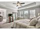 Bedroom with a tray ceiling, plush carpet, and soft, natural light at 5293 Hearthstone St, Stone Mountain, GA 30083