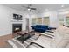 Cozy living room showcasing a fireplace, hardwood floors, and comfortable seating at 5650 Bergeson Way, Cumming, GA 30028