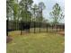 New backyard with black metal fencing around the perimeter at 161 Wards Crossing Way # 121, Johns Creek, GA 30022
