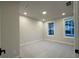 Bedroom with neutral carpet and two windows for natural light at 161 Wards Crossing Way # 121, Johns Creek, GA 30022