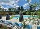 Enjoy the community pool area with plenty of lounge chairs for relaxing and a beautiful, sunny sky at 161 Wards Crossing Way # 121, Johns Creek, GA 30022