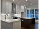 Beautiful kitchen with white cabinets, stainless steel appliances, and island with seating at 161 Wards Crossing Way # 121, Johns Creek, GA 30022