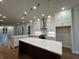 Open concept kitchen with large island, pendant lights, and modern appliances at 161 Wards Crossing Way # 121, Johns Creek, GA 30022