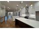 Spacious kitchen featuring large island, modern appliances, and open to living area at 161 Wards Crossing Way # 121, Johns Creek, GA 30022
