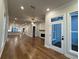 Open concept living room with hardwood floors and access to the patio at 161 Wards Crossing Way # 121, Johns Creek, GA 30022
