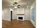 Spacious living room with hardwood floors and a fireplace at 161 Wards Crossing Way # 121, Johns Creek, GA 30022