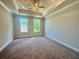 Spacious main bedroom features a trey ceiling and two windows for an airy and bright feel at 161 Wards Crossing Way # 121, Johns Creek, GA 30022