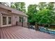 Elevated back deck offers views of a lush backyard featuring a pool and spa at 1617 Windsor Ne Pkwy, Brookhaven, GA 30319