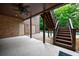 Backyard includes covered patio, stairs to the upper deck and access to pool area at 1617 Windsor Ne Pkwy, Brookhaven, GA 30319
