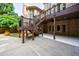 Backyard features multi-level deck with stairs down to a patio and yard at 1617 Windsor Ne Pkwy, Brookhaven, GA 30319