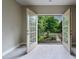Cozy balcony features double doors, wrought iron railing and views of lush greenery at 1617 Windsor Ne Pkwy, Brookhaven, GA 30319