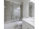 Well-lit bathroom with tiled shower, soaking tub, white vanity and large mirror at 1617 Windsor Ne Pkwy, Brookhaven, GA 30319