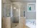 Bathroom with step-in shower, soaking tub and tiled surround at 1617 Windsor Ne Pkwy, Brookhaven, GA 30319