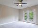 Bedroom featuring carpet, neutral paint and french doors to an exterior at 1617 Windsor Ne Pkwy, Brookhaven, GA 30319