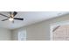 Bedroom featuring a ceiling fan and window with view at 1617 Windsor Ne Pkwy, Brookhaven, GA 30319