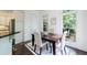Bright dining area featuring custom trim, a table for four and a large window at 1617 Windsor Ne Pkwy, Brookhaven, GA 30319