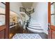 Open foyer showcasing a beautiful curved staircase, elegant hardwood floors, and abundant natural light at 1617 Windsor Ne Pkwy, Brookhaven, GA 30319