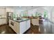 Open-concept kitchen featuring a large center island with granite countertops and stainless steel appliances at 1617 Windsor Ne Pkwy, Brookhaven, GA 30319