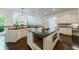 Large kitchen with island, stainless appliances, and views to a vaulted keeping room at 1617 Windsor Ne Pkwy, Brookhaven, GA 30319