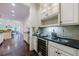 Kitchen with bar area, custom cabinets, granite countertops and wine cooler at 1617 Windsor Ne Pkwy, Brookhaven, GA 30319