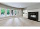 Spacious living room with fireplace, large windows and plenty of natural light at 1617 Windsor Ne Pkwy, Brookhaven, GA 30319