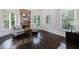 Spacious main bedroom with stone fireplace and hardwood flooring at 1617 Windsor Ne Pkwy, Brookhaven, GA 30319