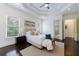 Relaxing main bedroom with large windows, trey ceiling, and doorway leading to bathroom at 1617 Windsor Ne Pkwy, Brookhaven, GA 30319