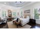 Serene main bedroom with stone fireplace, trey ceiling, and ample windows for natural light at 1617 Windsor Ne Pkwy, Brookhaven, GA 30319