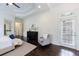 Bright main bedroom featuring a large window, seating area, and doorway to another room at 1617 Windsor Ne Pkwy, Brookhaven, GA 30319