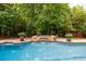 Beautiful pool area featuring stone hot tub and plenty of privacy at 1617 Windsor Ne Pkwy, Brookhaven, GA 30319