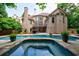 A beautiful swimming pool in a backyard of a brick two-story home at 1617 Windsor Ne Pkwy, Brookhaven, GA 30319