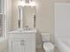 Bright bathroom featuring a white vanity with marble countertop and subway tile shower at 169 Wards Crossing Way # 125, Johns Creek, GA 30022