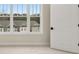 Bedroom view overlooking neighboring home with natural light and a crisp white door at 169 Wards Crossing Way # 125, Johns Creek, GA 30022