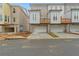 Townhome with two-car garage and gray siding at 169 Wards Crossing Way # 125, Johns Creek, GA 30022