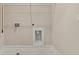 Laundry room with hookups for a washer and dryer and a utility sink for added convenience at 169 Wards Crossing Way # 125, Johns Creek, GA 30022