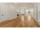 Living room featuring hardwood floors and natural light through multiple windows at 169 Wards Crossing Way # 125, Johns Creek, GA 30022