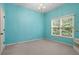 Bedroom features natural light, a walk-in closet, neutral carpet, and is painted a bright color at 1903 Brackendale Nw Rd, Kennesaw, GA 30152