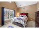 Bedroom featuring a window, neutral carpet, ceiling fan, and a double bed at 1903 Brackendale Nw Rd, Kennesaw, GA 30152