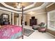 Large main bedroom boasts a seating area, tray ceilings, carpet, and nice natural light at 1903 Brackendale Nw Rd, Kennesaw, GA 30152